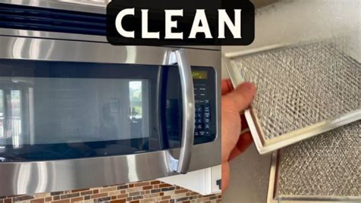 How do you change a grease filter in a microwave