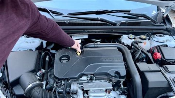 How do you check the oil on a RV generator?