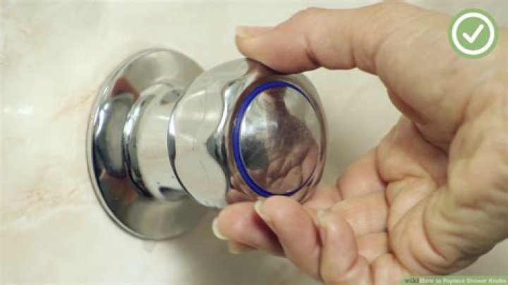 How do you remove a shower knob from a faucet?