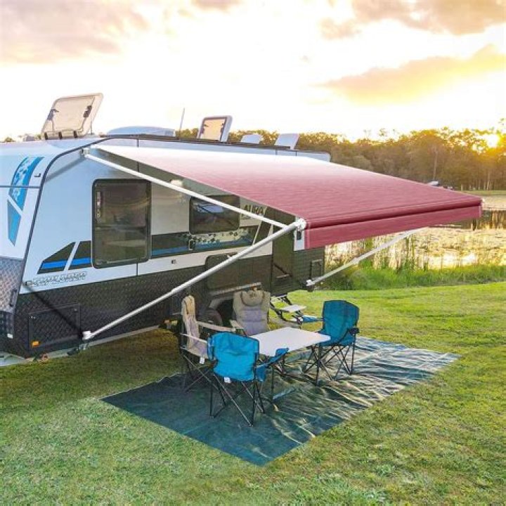 How do you slide an awning out of an RV?