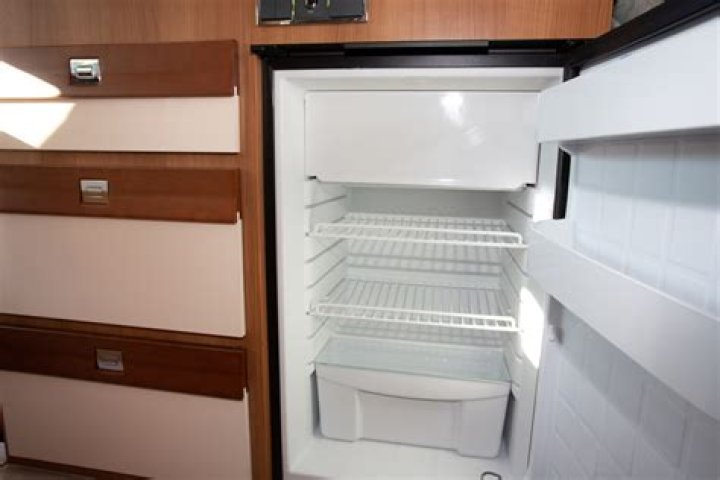 How does a refrigerator work in an RV?