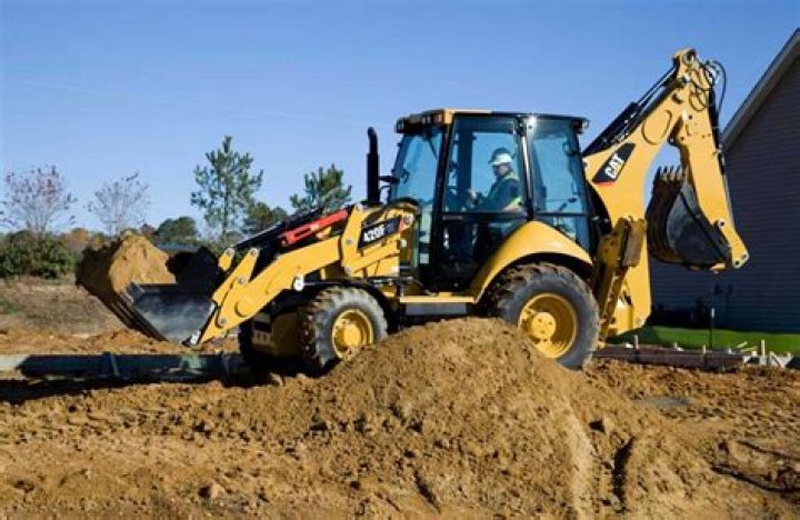 How much does a full size backhoe weight