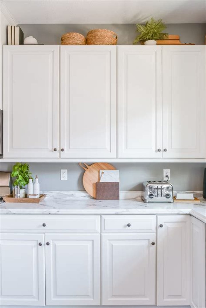 Should you put decor on top of kitchen cabinets