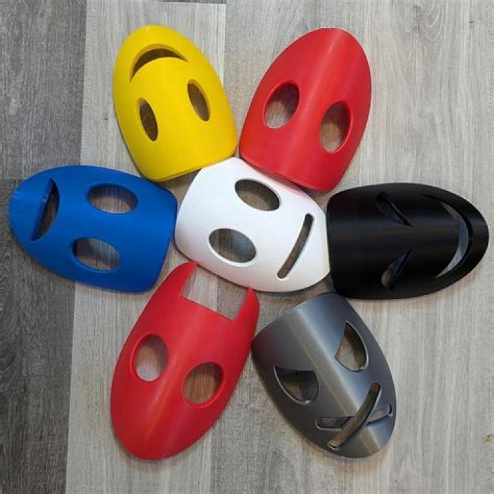 What are the smiling and frowning masks called