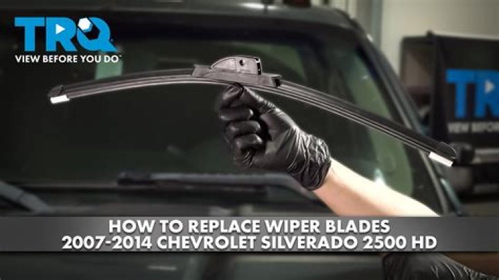 What holds the wiper blade on the wiper arm?