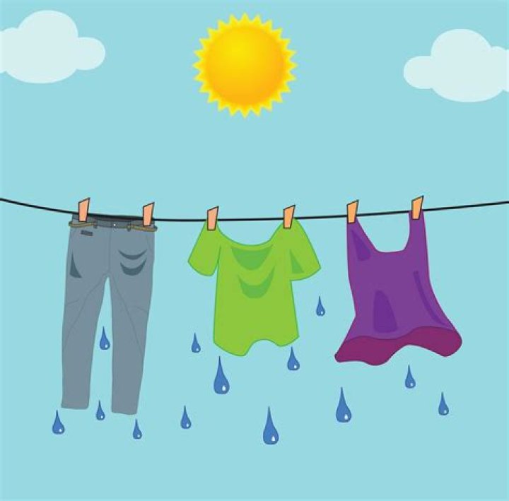 What process occurs when wet clothes drying under the sun?