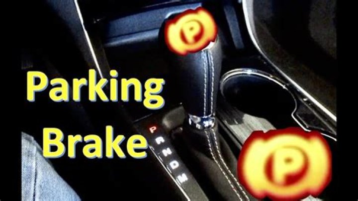 Where is the parking brake located?