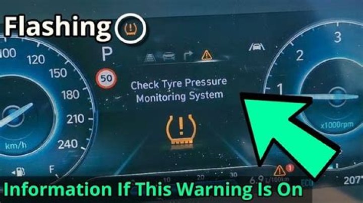 Why is the warning light on my freezer?