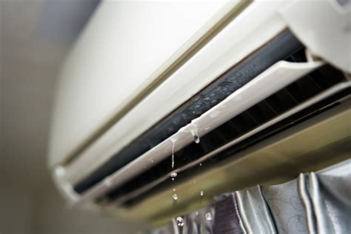 Why is water coming from the front side of my air conditioner?